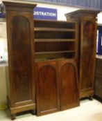 A Victorian mahogany breakfront triple wardrobe with linen press central section,