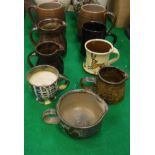 A collection of various studio pottery including two Poole Sylvan ware M70 mugs,