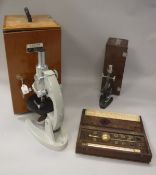 A Chinese bio microscope by the Wu Chow Optical Instruments factory together with another smaller