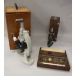 A Chinese bio microscope by the Wu Chow Optical Instruments factory together with another smaller