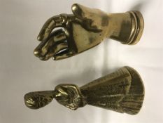 A vintage solid cast brass hand with Masonic ring and ornate cuff as a paperweight,