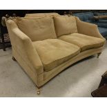 A modern fawn upholstered Knole style sofa, with swept arms and concave front rail,