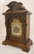 A late 19th Century walnut cased mantel clock, the eight day movement by Junghans,
