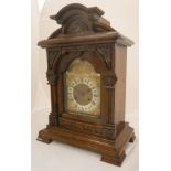 A late 19th Century walnut cased mantel clock, the eight day movement by Junghans,