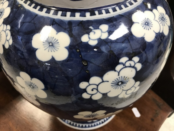 A 19th Century Chinese blue and white prunus blossom decorated baluster shaped vase and cover on a - Image 6 of 24