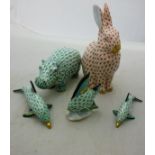 A Herend oxide red seated rabbit figure, a green hippo figure,