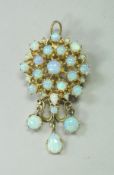 A 14 carat gold and opal set pendant / brooch,