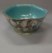 A late 19th Century Chinese polychrome decorated hexagonal bowl decorated with figures in a garden