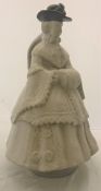 A 19th Century Mettlach style character jug as a woman with hands in muff raised on a circular base