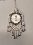 An 18 carat white gold diamond encrusted pendant of Middle Eastern style