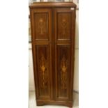 A mahogany and marquetry inlaid two door cupboard of slim proportions in the Sheraton Revival taste