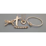 A collection of silver Tiffany jewellery comprising bangle, Paloma Picasso cross pendant,