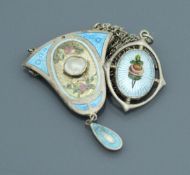 A George V silver and enamel decorated harebell shaped pendant with central pearl medallion (by