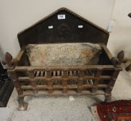 A cast iron fire basket together with another fire basket and fireback with fleurs de lys