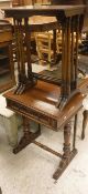 A Victorian mahogany work table with single drawer on end pillar supports,