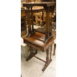 A Victorian mahogany work table with single drawer on end pillar supports,