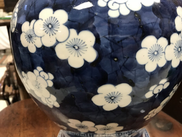 A 19th Century Chinese blue and white prunus blossom decorated baluster shaped vase and cover on a - Image 11 of 24