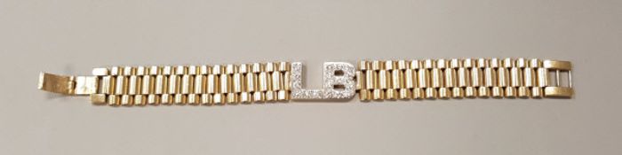 A Rolex style 9 carat gold bracelet with diamond encrusted initials "LB" to the centre,