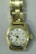 A late 20th Century 18 carat ladies gold Rolex Oyster Precision wristwatch and strap.