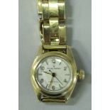 A late 20th Century 18 carat ladies gold Rolex Oyster Precision wristwatch and strap.