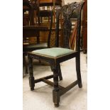 A set of six Victorian carved oak dining chairs