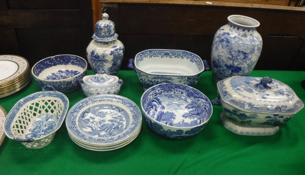 A collection of various blue and white china to include transfer decorated chestnut basket,