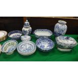 A collection of various blue and white china to include transfer decorated chestnut basket,