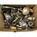 A box containing assorted plated wares to include cutlery, sugar caster, chamber sticks,