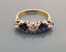 A diamond and sapphire set five stone ring, total diamond carat weight approx 0.