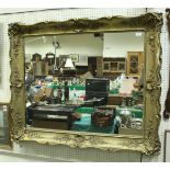 A large 18th Century style giltwood and gesso framed wall mirror,