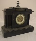 A 19th Century French black marble cased mantel clock of architectural form with eight day movement