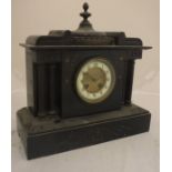 A 19th Century French black marble cased mantel clock of architectural form with eight day movement