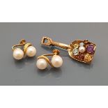 A pair of 14 carat gold mounted double pearl earrings,