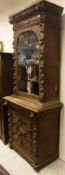 A Victorian carved oak Gothic Revival bookcase cabinet of slim proportions CONDITION