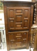 An early 18th Century Continental oak two door cupboard with panelled doors,