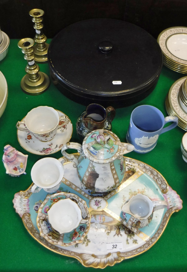 A Carl Thieme Potschappel teacup, saucer, cream jug and water jug with matching tray,