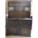 An oak dresser in the Old Charm manner, a similar glazed cabinet,