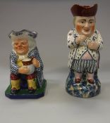 A Copeland Spode polychrome decorated seated toby jug together with another 19th Century polychrome