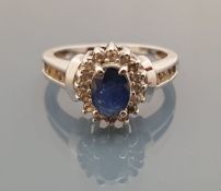 A 14 carat white gold sapphire and diamond set cluster ring, ring size P / Q, total weight 3.