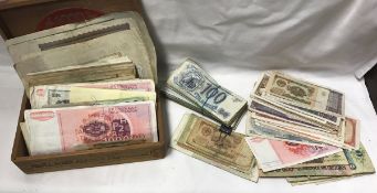 A cigar box containing a collection of various vintage and other bank notes including early 20th