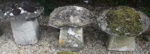 A collection of three natural stone staddle stones