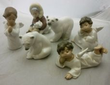 A collection of six various Lladro figures including two polar bears,