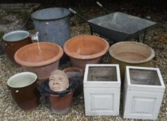 An anodised metal twin-handled bin, together with a wheelbarrow, four various terracotta pots,