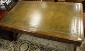 A Regency style mahogany writing desk with plain top with leather insert above three drawers and