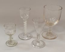 An 18th Century wine glass with ogee bowl on a plain stem with double series opaque twist