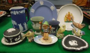 A collection of various 20th Century English chinawares to include Royal Worcester bird figures