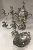 A box containing a twin-handled silver plated lidded trophy cup with blank cartouche,