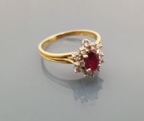 An 18 carat gold ruby cluster ring, ring size Q,