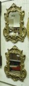 A pair of 19th Century giltwood wall mirrors with carved foliate and C scroll decorated frames