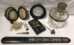 A box of various ornamental items including an ebony and ivory inlaid paperknife or page turner,